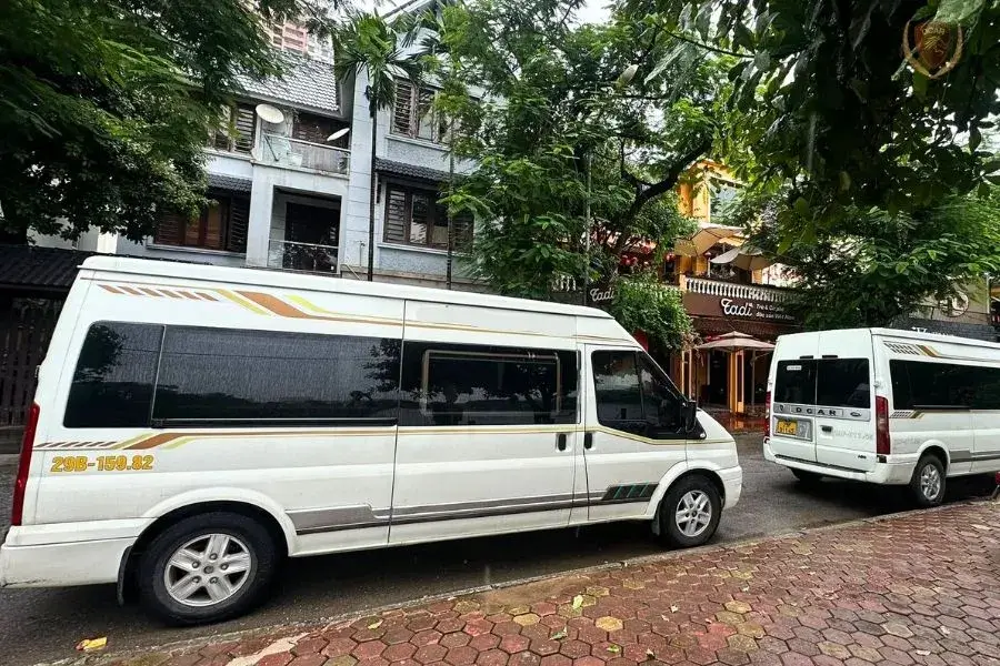 A limousine picking up passengers in a Hanoi Old Quarter's narrow road